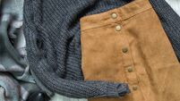 Brown skirt and gray sweater. Fashionable concept
