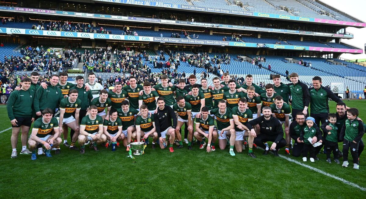Kerry players and backroom staff with the new Corn Mhíchíl Uí Mhuircheartaigh after their side's victory in the Allianz Football League Division 1. Photo: Piaras Ó Mídheach / Sportsfile Kerry players and backroom staff with the new Corn Mhíchíl Uí Mhuircheartaigh after their side's victory in the Allianz Football League Division 1. Photo: Piaras Ó Mídheach / Sportsfile